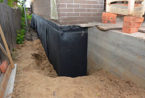 SJ Waterproofing Pros technician performing targeted Exterior Waterproofing assessment in Chevy Chase, MD
